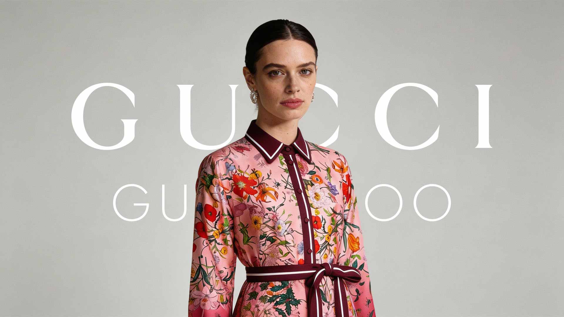 Model wearing a pink floral dress with burgundy trim, standing against a gray backdrop with large Gucci lettering across the image (Gucci ad).